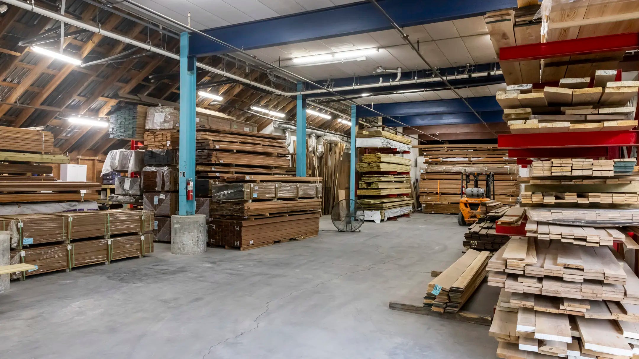 Stacks of dimensional lumber in a warehouse