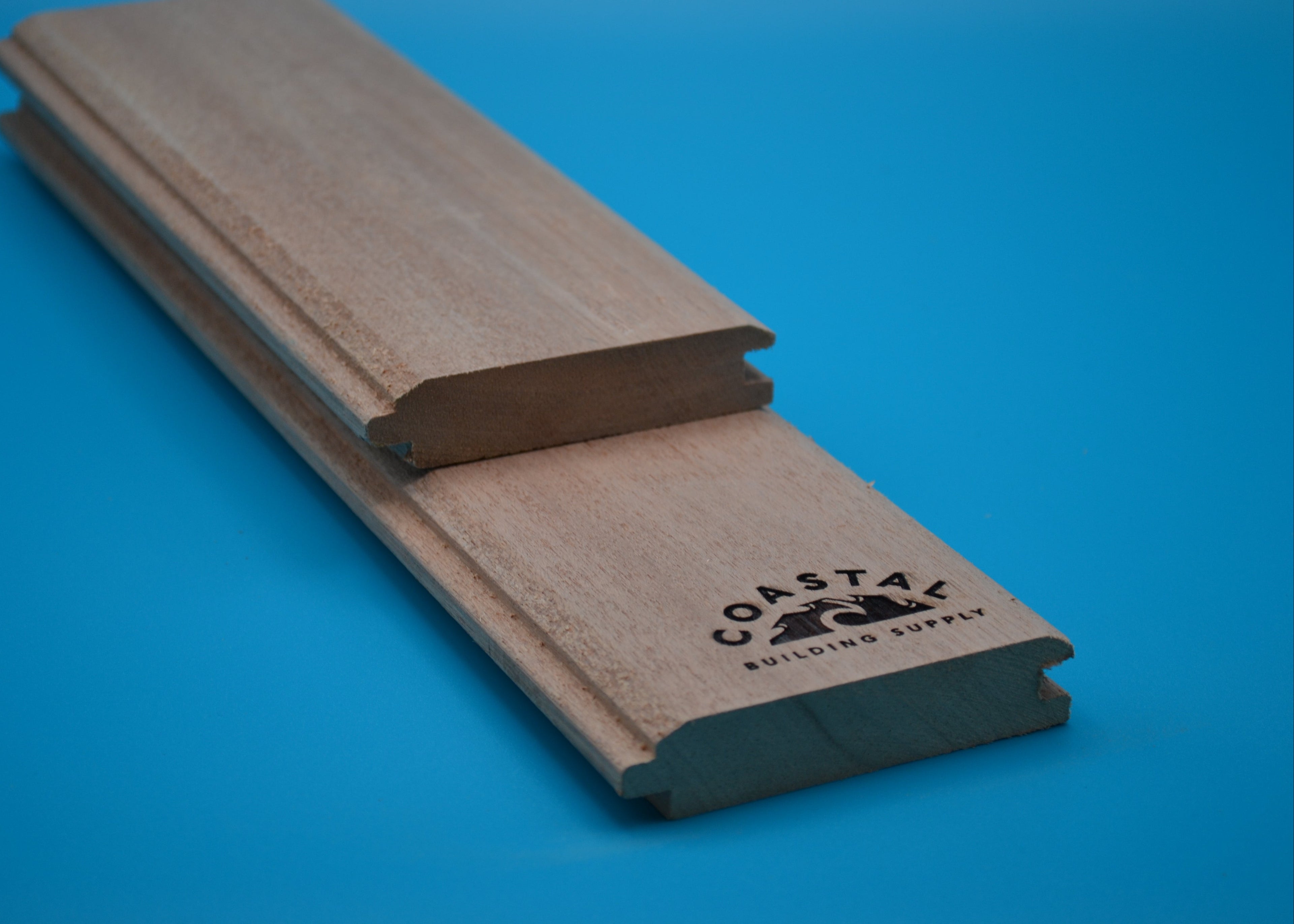 1 x 4 Mahogany Wood (T&G V-Groove/Shiplap) on a blue background