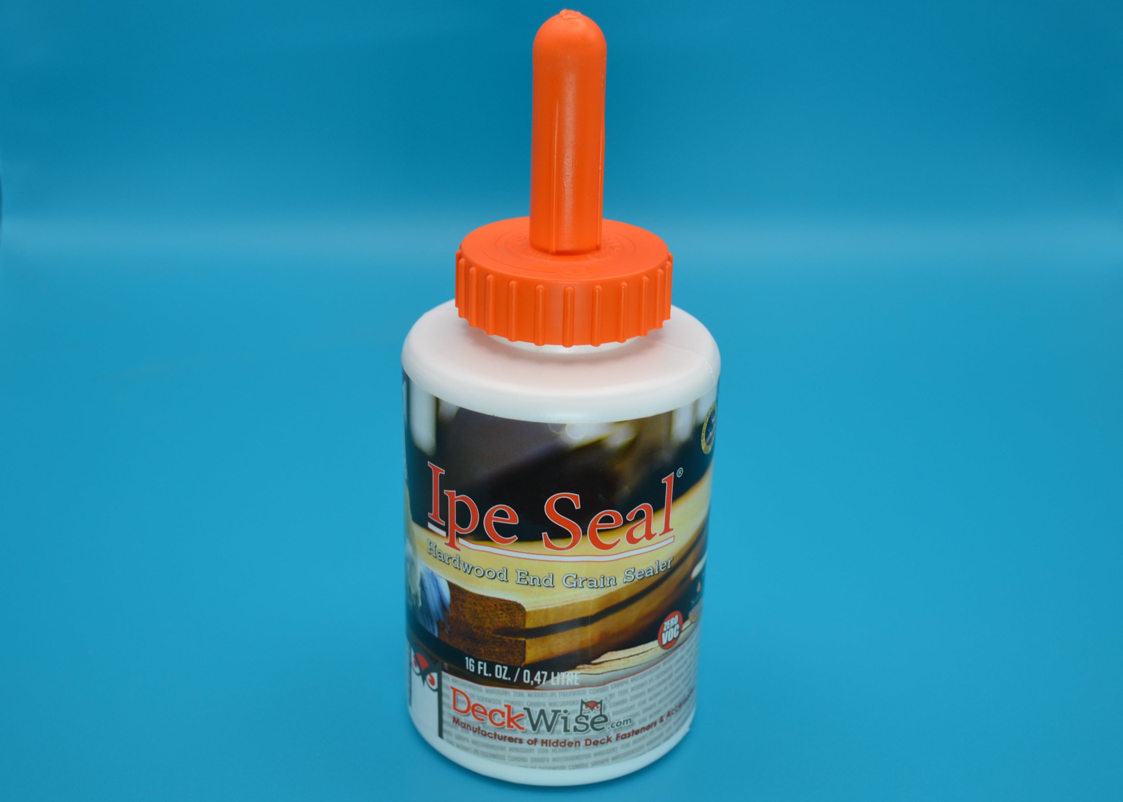 Bottle of Ipe Seal with an orange cap on a blue background