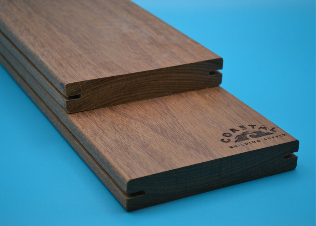 Ipe 5/4x6 E4E Grooved Decking Planks on blue background