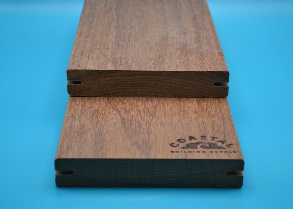 Ipe 5/4x6 E4E Grooved Decking Planks on blue background