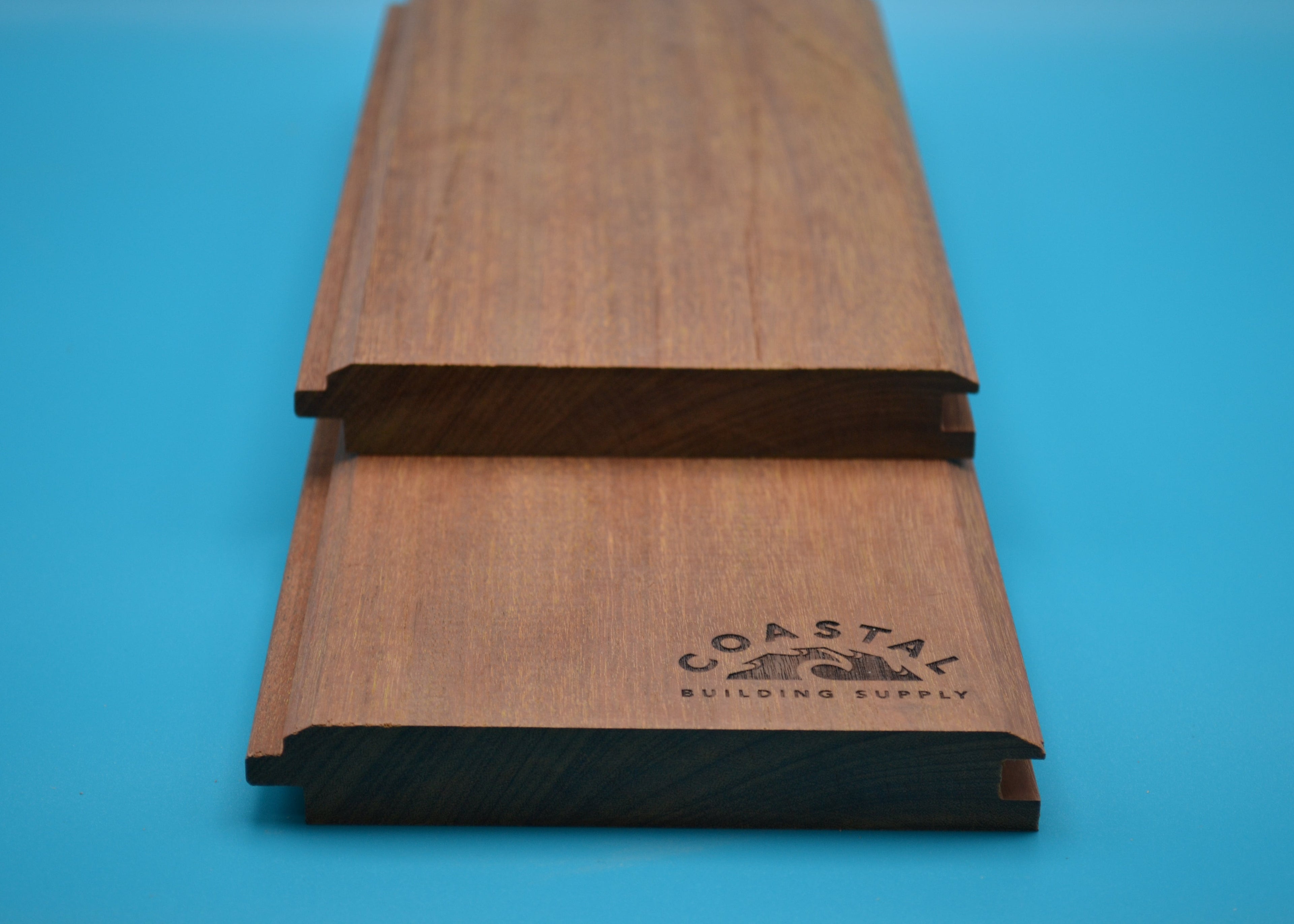 Ipe 1x6 V-Lap Planks on blue background