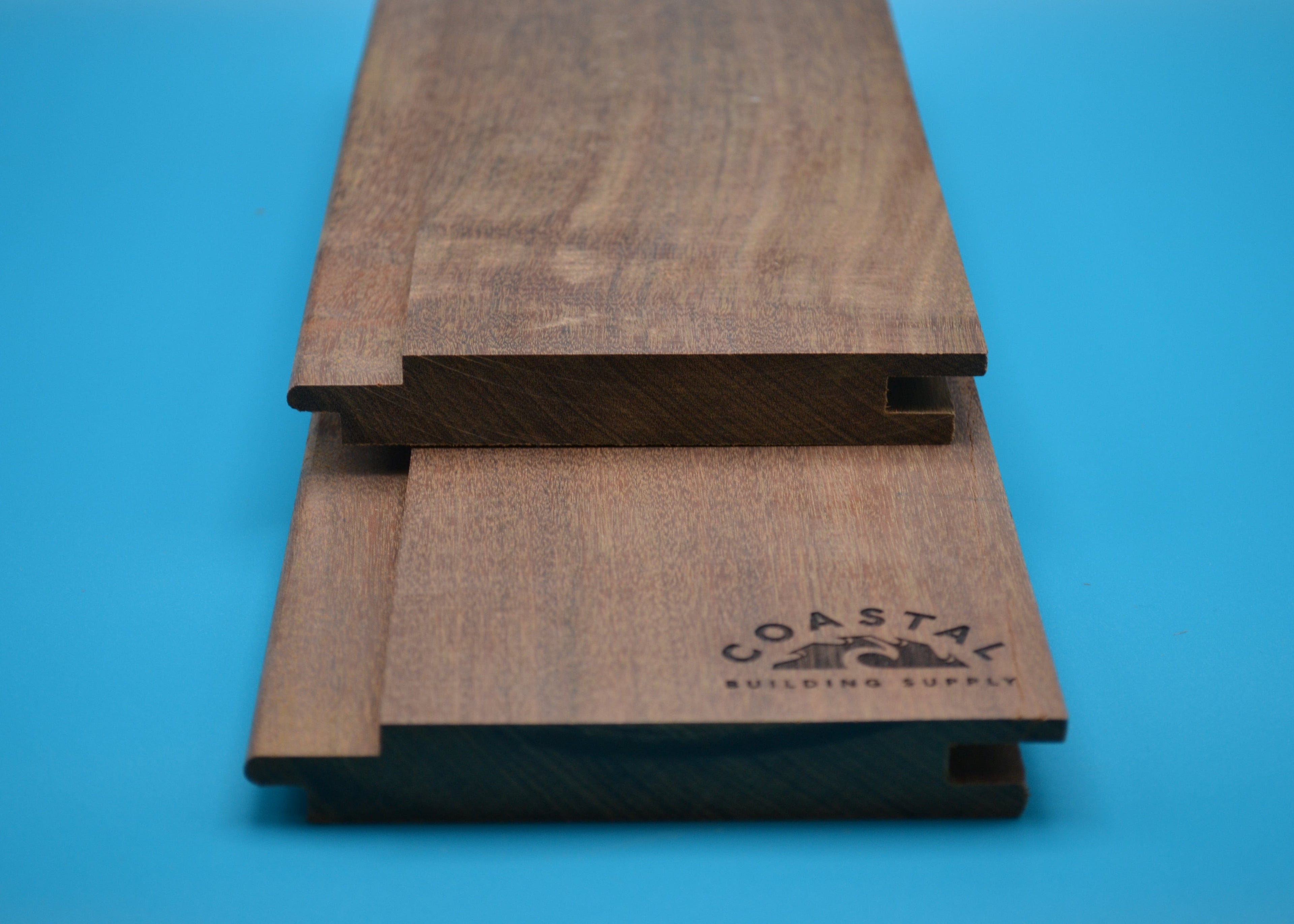 Ipe 1x6 Hidden Nail T&G Planks on blue background