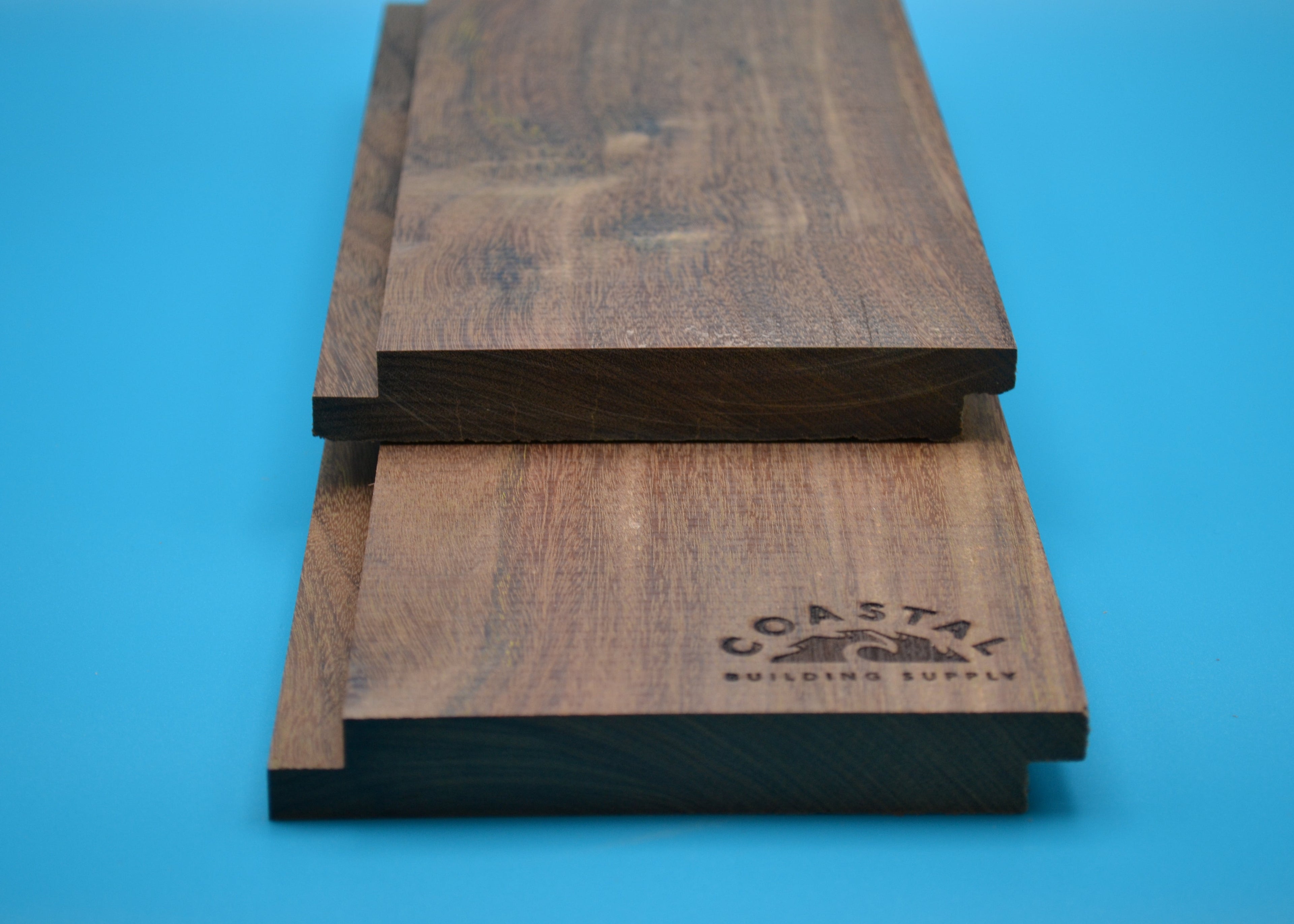 Ipe 1x6 Shiplap Planks on blue background