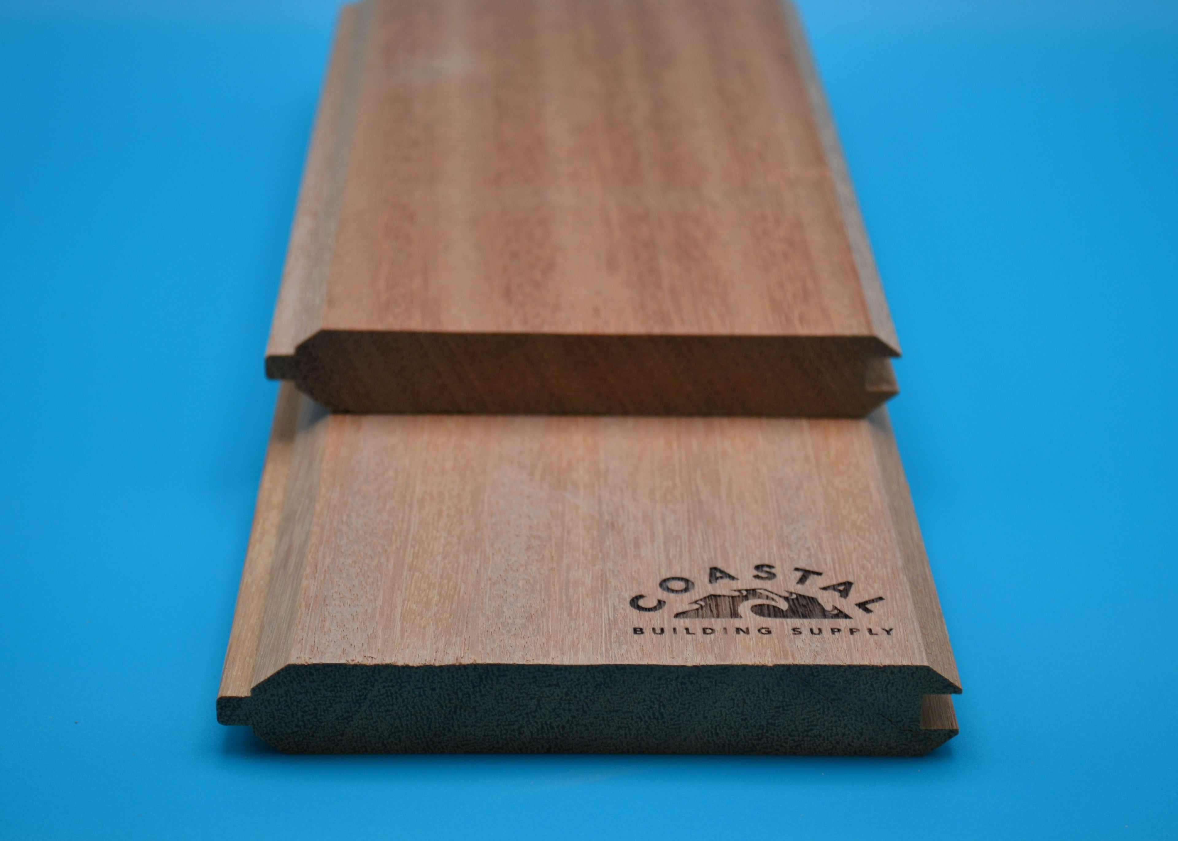 Ipe 1x6 T&G V Groove Planks on blue background