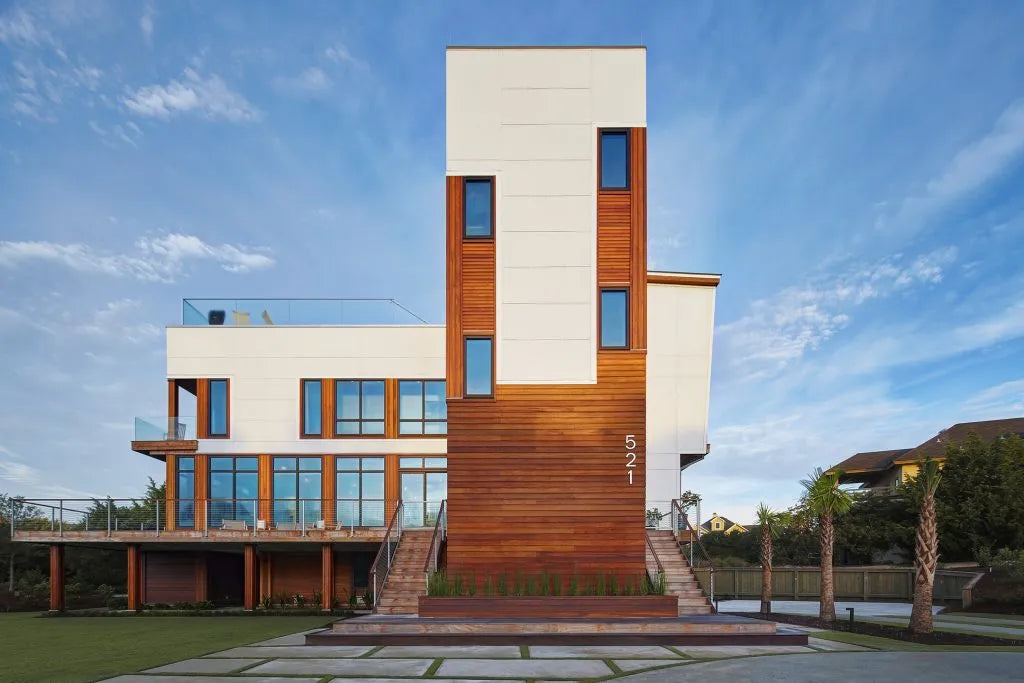 Modern house with a combination of white and wood exterior design.
