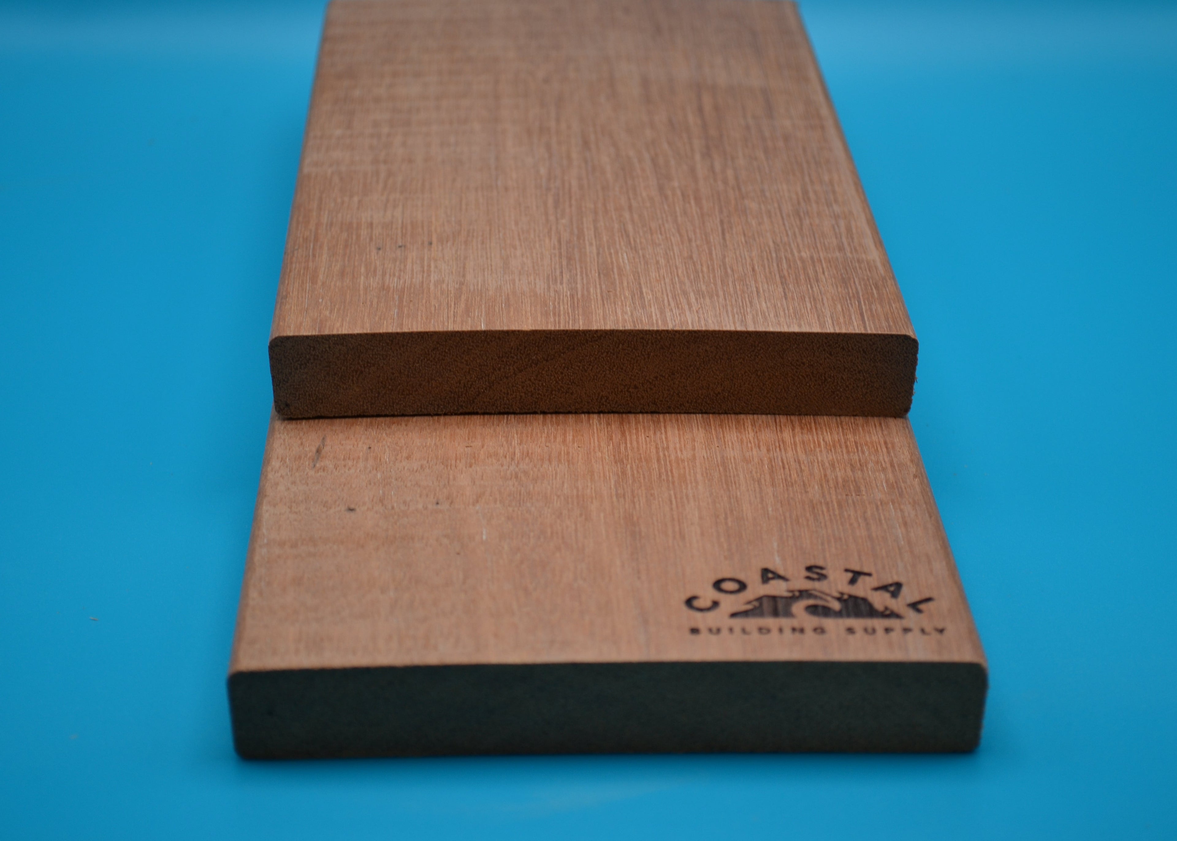 Red Balau 1x6 E4E Decking Planks on blue background