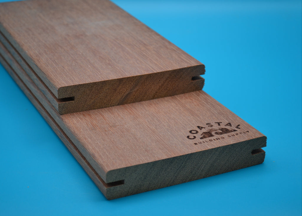 5/4 x 6 Red Balau Wood Decking (E4E Grooved) on a blue background