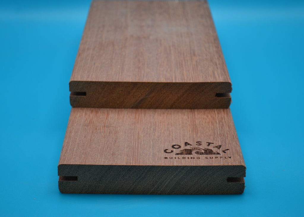 5/4 x 6 Red Balau Wood Decking (E4E Grooved) on a blue background