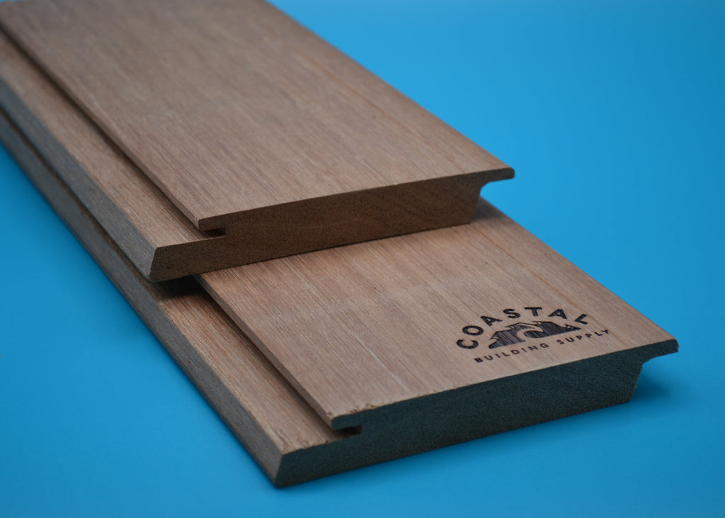 Red Balau 1x6 Rainscreen boards on blue background