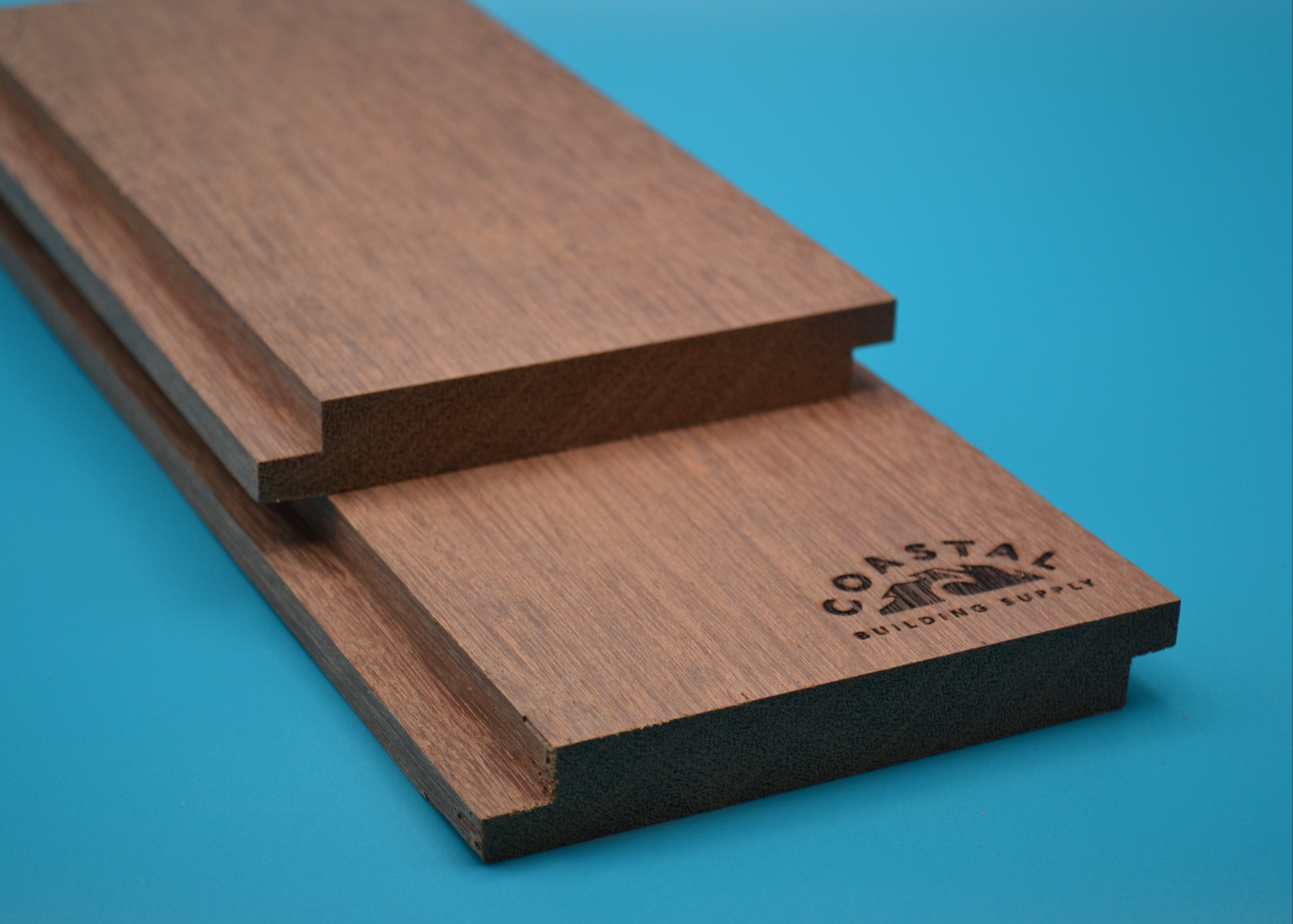 Red Balau 1x6 Shiplap Planks on blue background