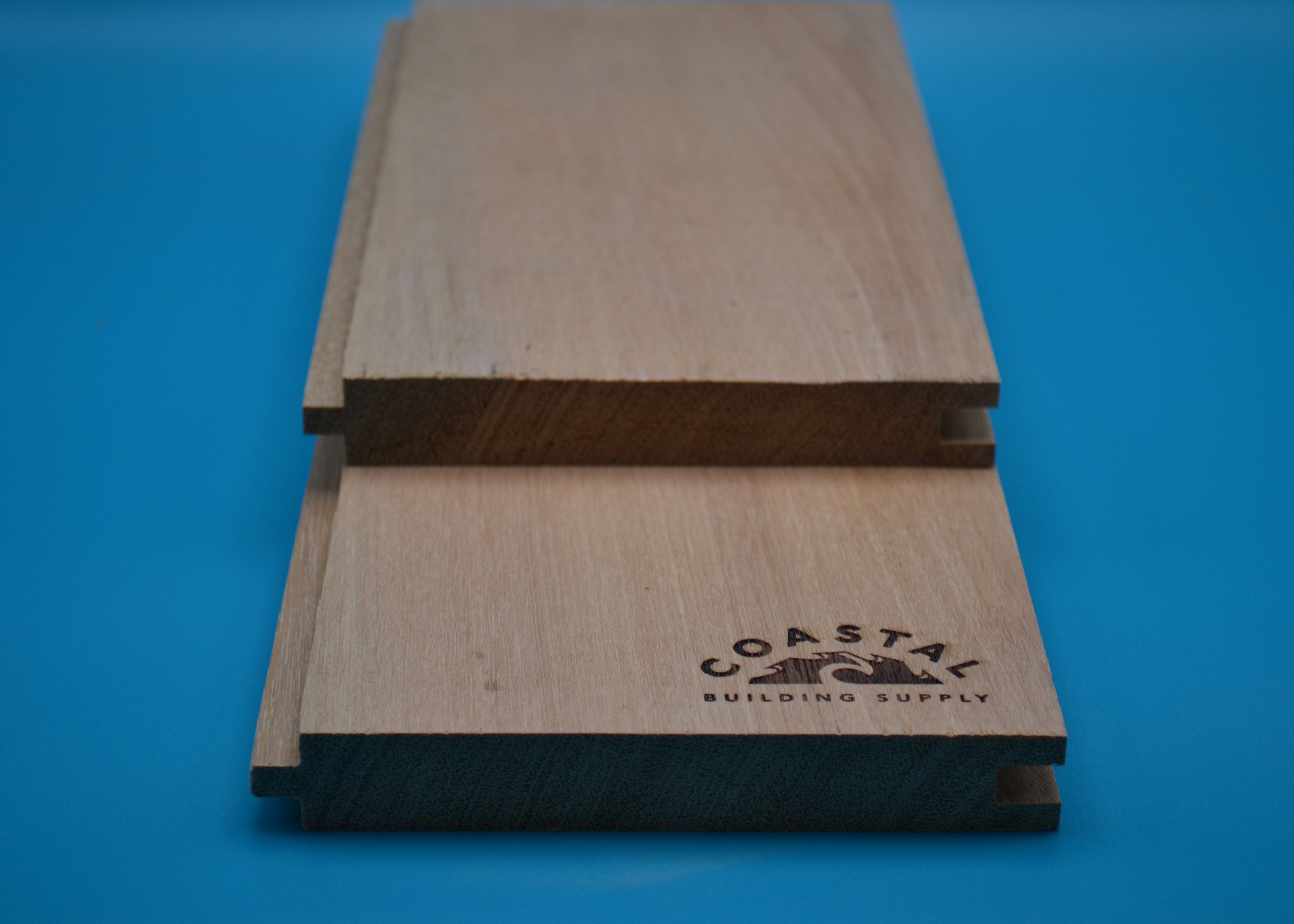 Yellow Balau 1x6 T&G Flushgap Planks on blue background
