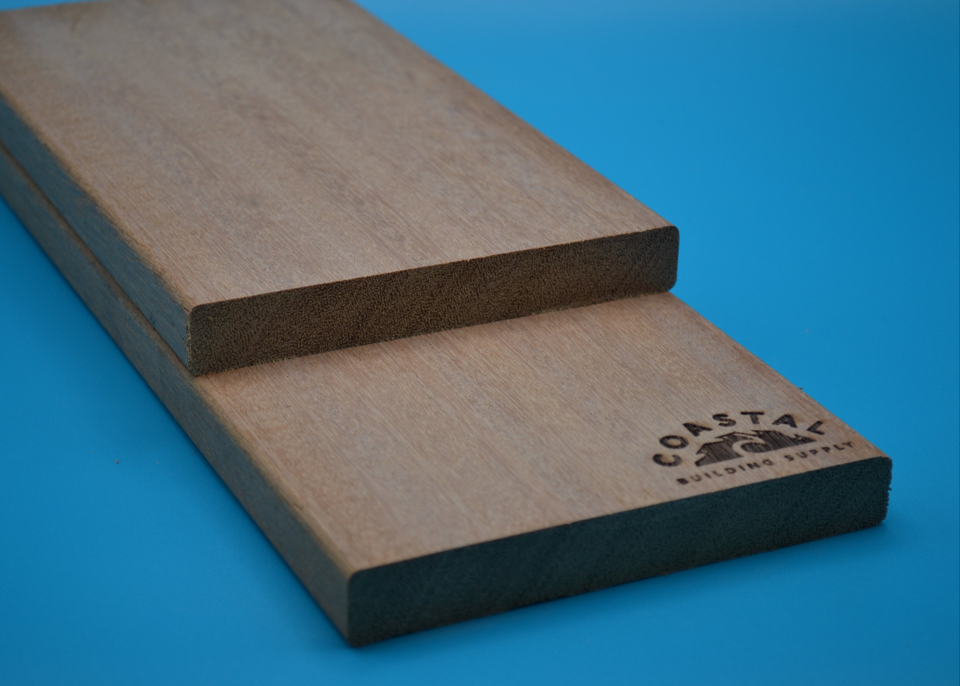 Yellow Balau 1x6 E4E Decking Planks on blue background