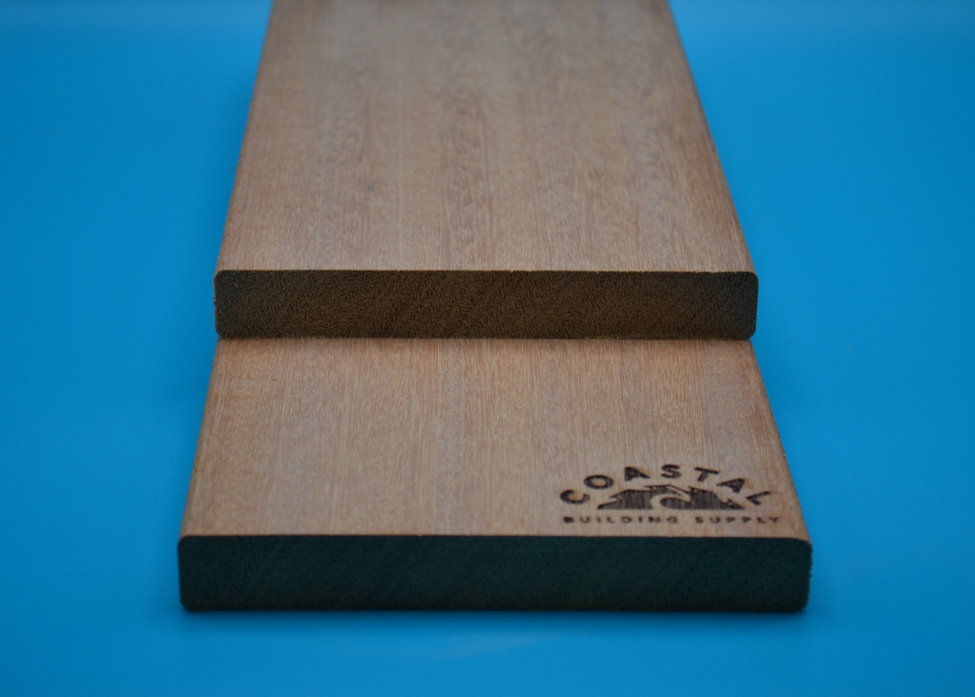 Yellow Balau 1x6 E4E Decking Planks on blue background
