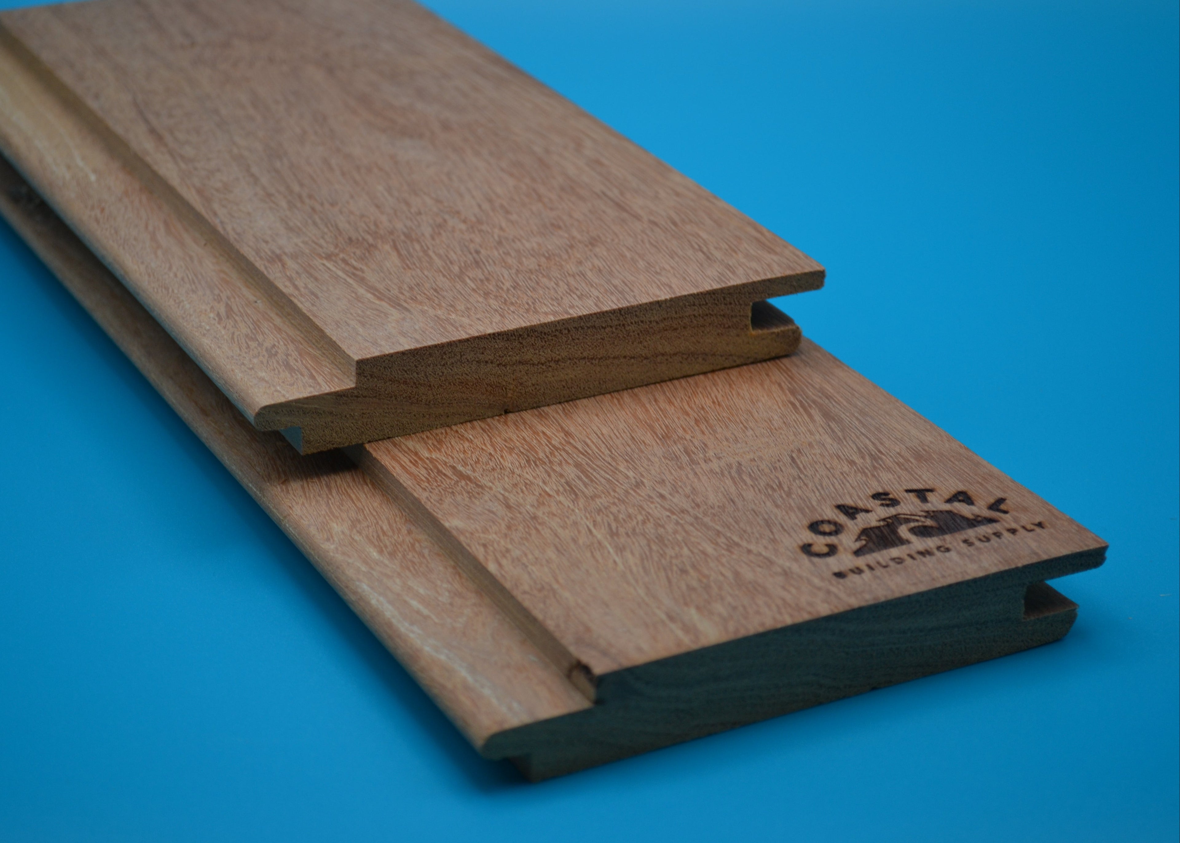 Yellow Balau 1x6 Hidden Nail T&G Planks on blue background