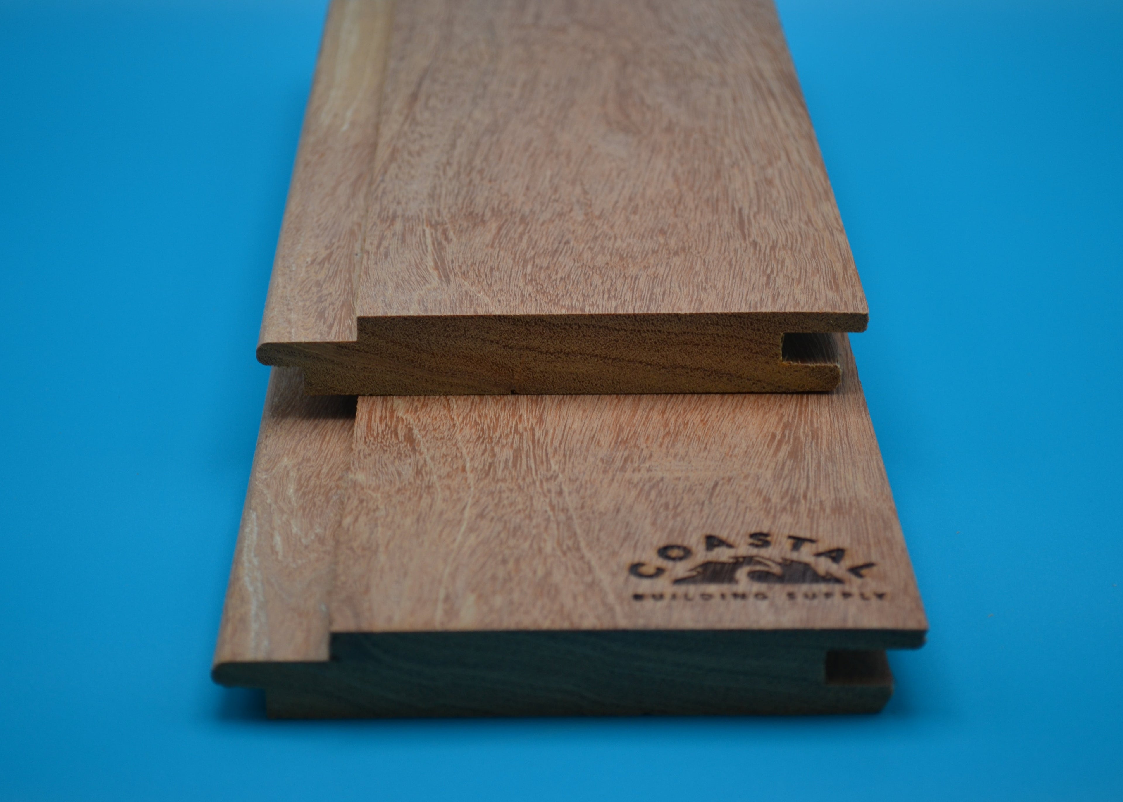 Yellow Balau 1x6 Hidden Nail T&G Planks on blue background