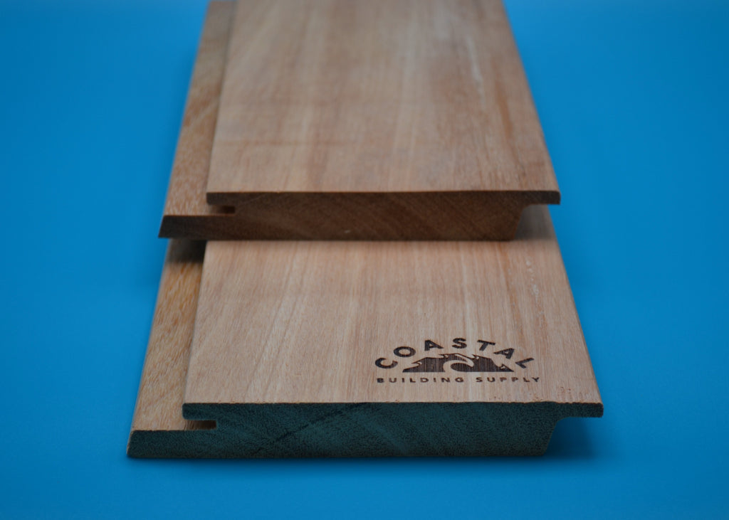 Yellow Balau 1x6 Rainscreen Planks on blue background