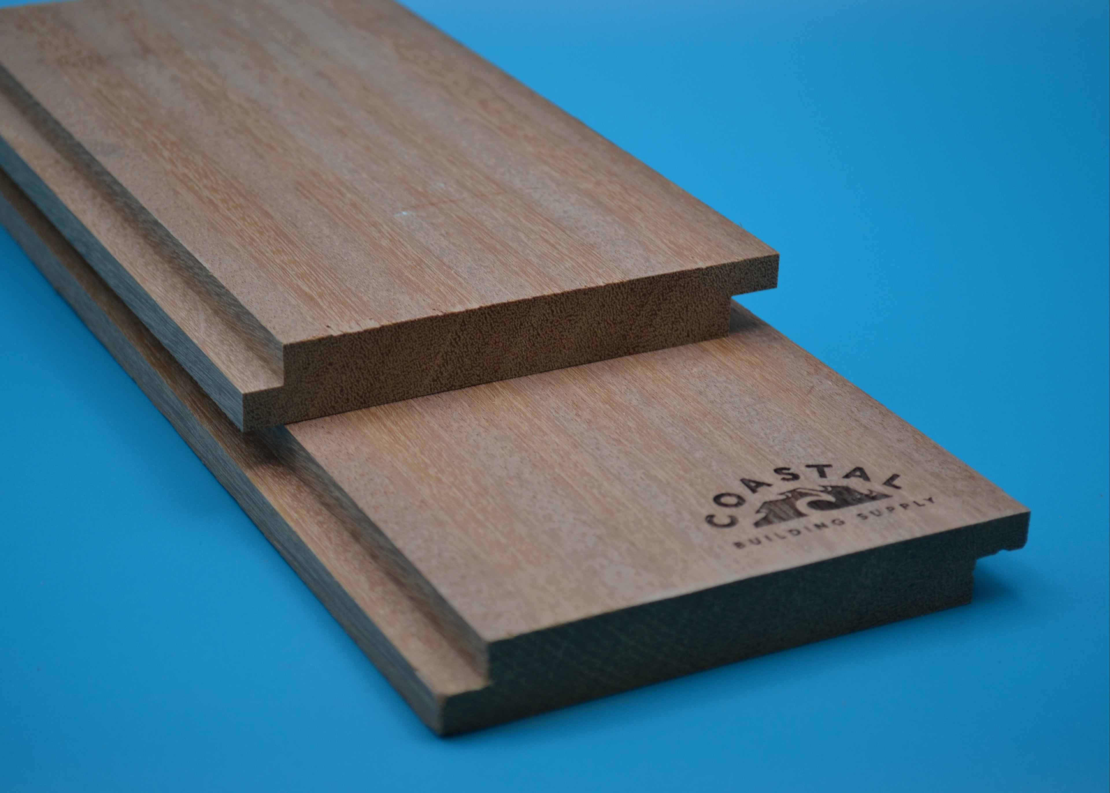 Yellow Balau 1x6 Shiplap Planks on blue background