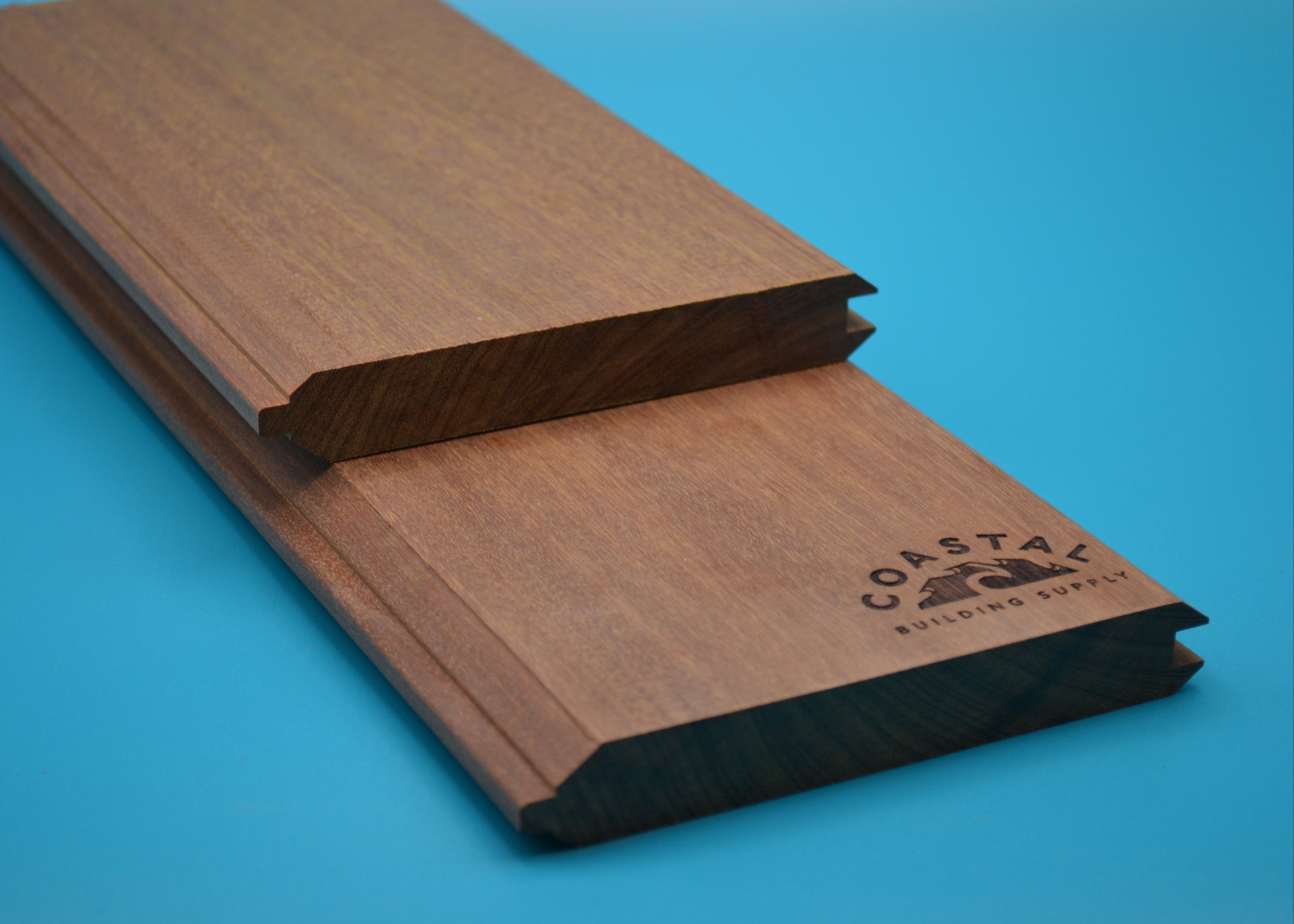 Yellow Balau 1x6 T&G V Groove Planks on blue background