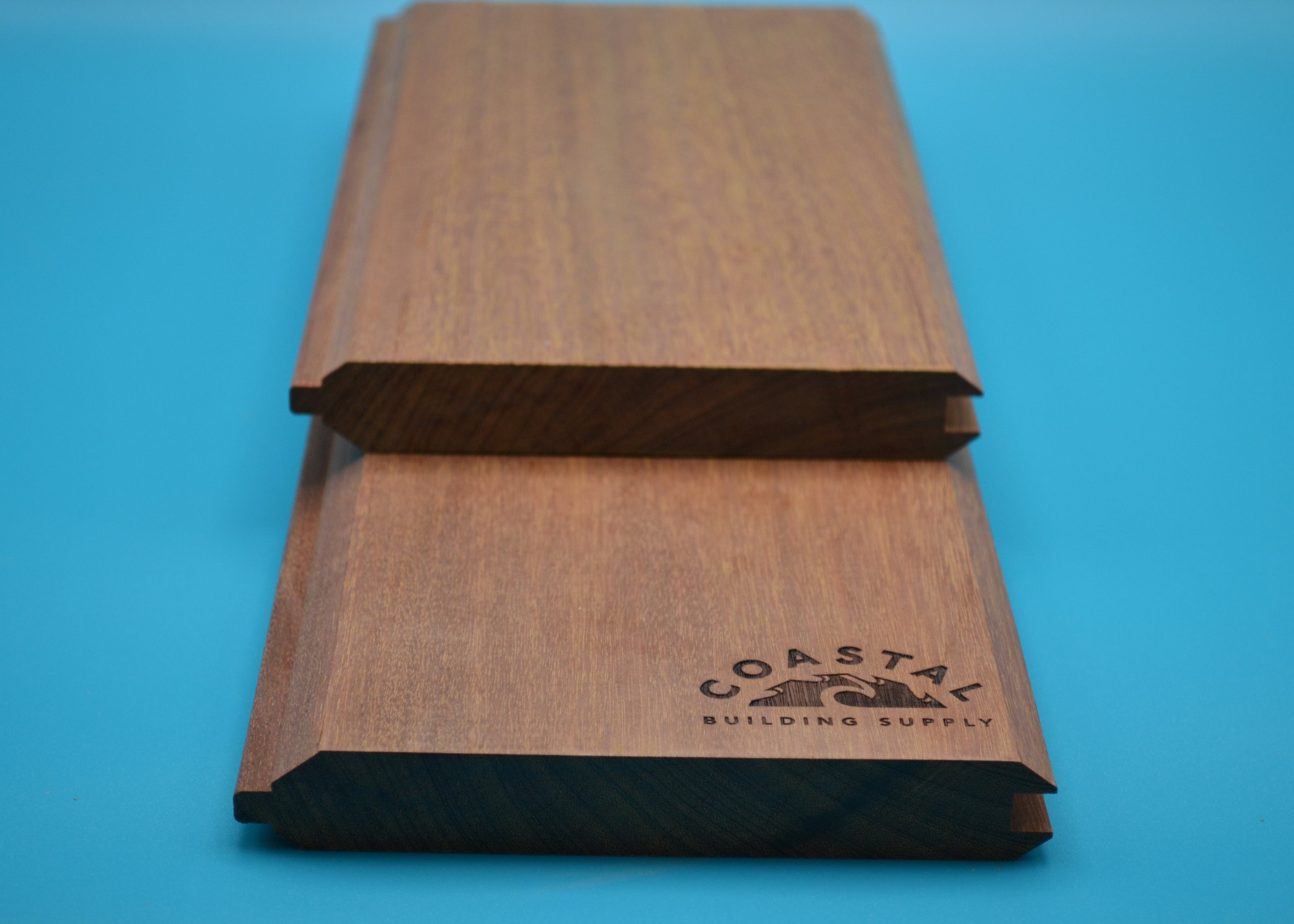 Yellow Balau 1x6 T&G V Groove Planks on blue background